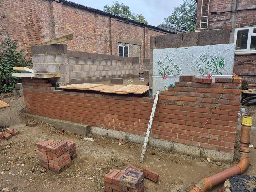 Brick & block — Facing brickwork and an insulated cavity wall built up from the foundations.